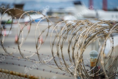 Preview: Barbed Wire On Fence Protecting Private Area