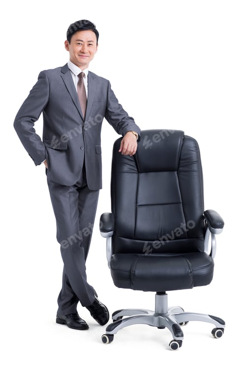 Preview: Mature businessman with boss chair