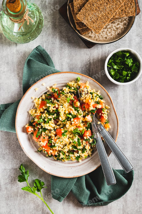 Preview: Traditional vegetarian tabbouleh salad on a plate on the table top and vertical view