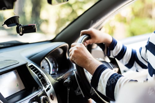 Preview: Man driving a family car