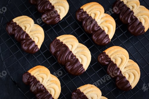 Preview: Homemade chocolate dipped shortbread cookies on dark background