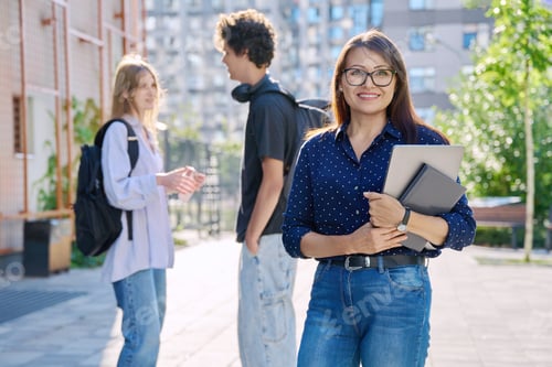 Preview: Portrait of woman teacher coach on educational building background