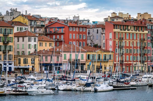 Preview: Red and orange buildings in Nice, France, boats and yachts at the Lympia port