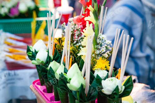 Preview: buddhist offerings on sale in front of a temple