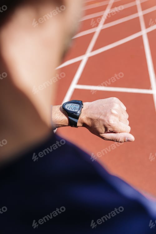 Preview: Male running jogging smart watch outside