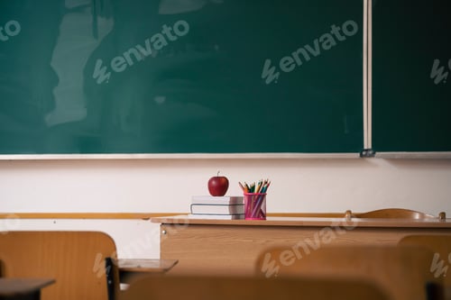 Preview: Classroom Scene with Apple, Books, and Green Board