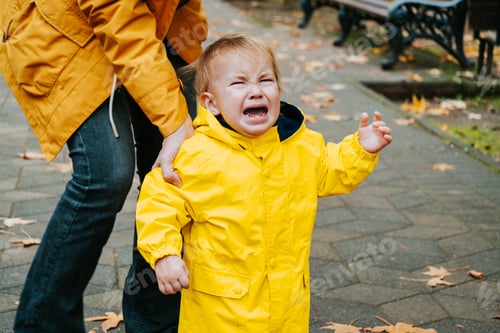 Preview: Crying little boy outdoor in the park.