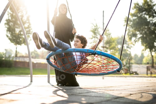 Preview: Woman with her children at the playground