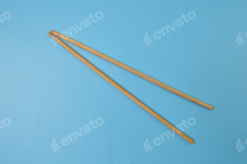 Preview: Wooden Chopsticks on a Light Blue Background