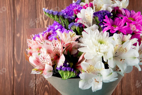 Preview: side view of a bouquet of pink white and purple color statice alstroemeria