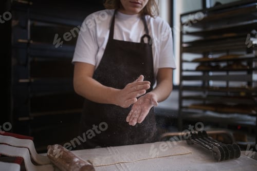 Preview: Close-up of baker preparing pastries in bakery.