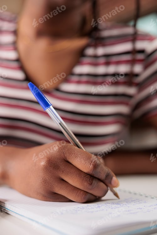 Preview: African american woman hand writing in notepad close up