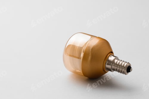 Preview: Light bulb on light grey paper background