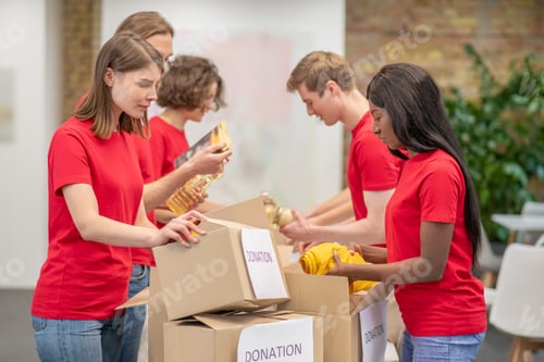 Preview: Young people working in a donations distribution center