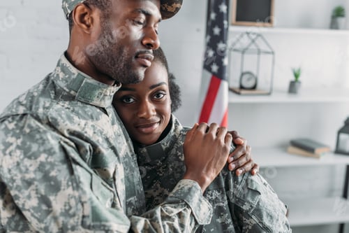 Preview: African american female and male soldiers embracing together