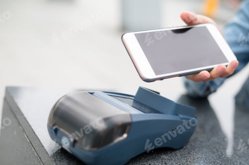 Preview: Woman using cellphone for payment