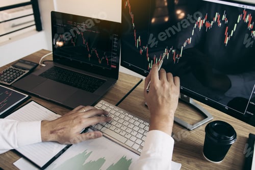 Preview: hand investors are pointing to laptop computer that have investment information