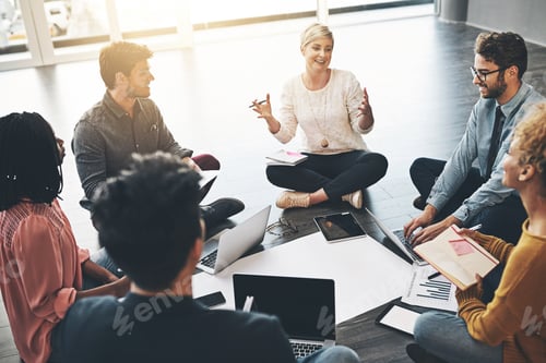 Preview: Shot of a diverse group of creative employees having a meeting inside