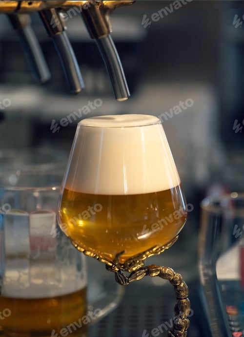 Preview: Full glass of fresh light beer near beer tap in pub.