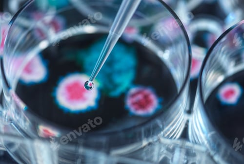 Preview: Pipetting potential cure onto virus in petri dish
