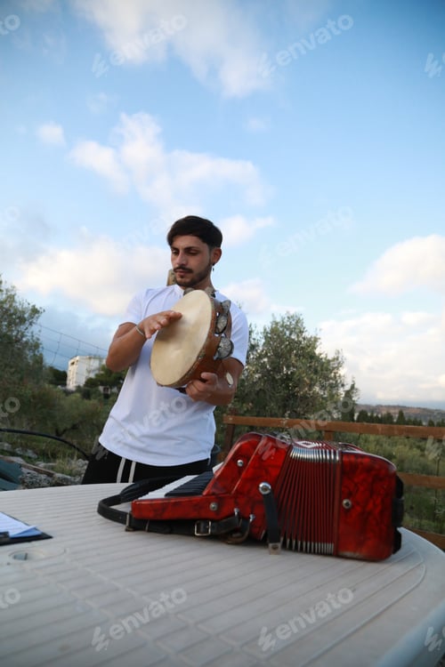 Preview: Happy Tambourine Player Performing in Fields