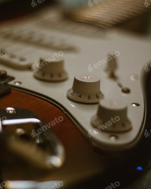Preview: Selective focus shot of the buttons on an electric guitar