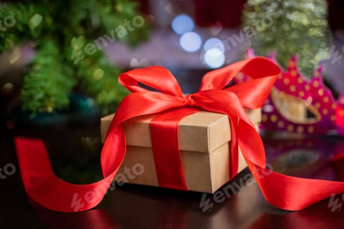 Preview: beautiful Christmas gift box in red with a bow on the snow for Valentine's Day decorations