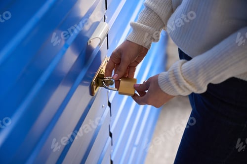 Preview: Woman hold lock, working in storage unit