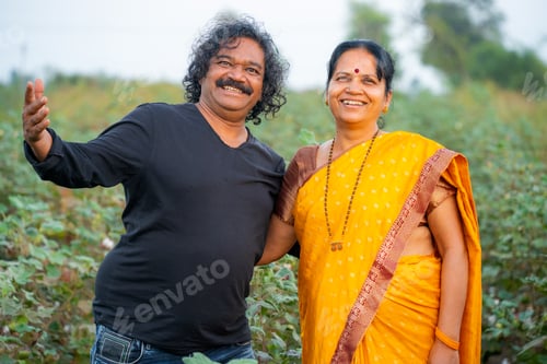 Preview: Happy Indian couple at their farm.