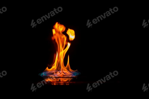 Preview: Intense flame, fire, burning brightly on a mirror surface with reflection,danger, catastrophic