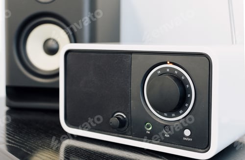 Preview: Close-up selective focus image of audio device, fm tuner, speaker on table.