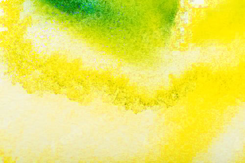 Preview: top view of yellow and green watercolor spills with copy space