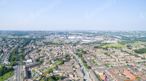 Preview: Beautiful aerial view of old houses and lush green trees in Bradford, West Yorkshire, UK
