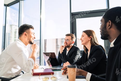 Preview: Office team listening to their colleague's report
