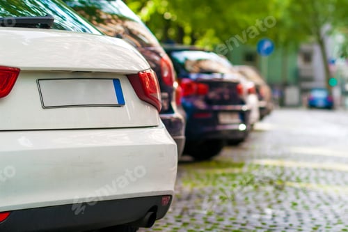 Preview: Rows of cars parked on the roadside in residential district