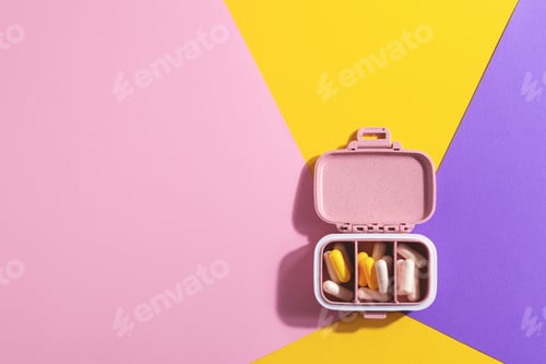 Preview: Pills organizer on multicolored background.