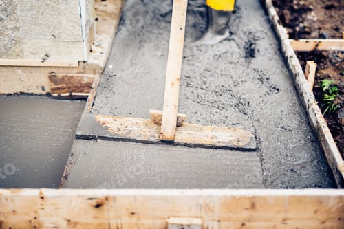 Preview: Mason building and leveling first layer of concrete floor