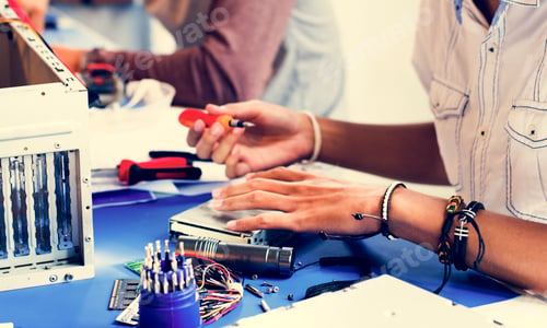 Preview: Group of people working at eletronic repair shop