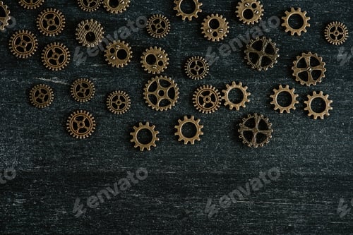 Preview: top view of vintage metal gears on dark wooden background