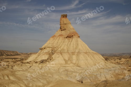 Preview: The Castildetierra of the Bardenas Reales in Navarra with clouds in the background. Spain