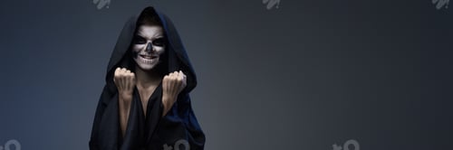 Preview: Smiling Skull-Like Character in Hooded Cloak Wide Banner