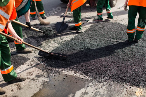 Preview: Workers on Asphalting paver machine during Road street repairing works.