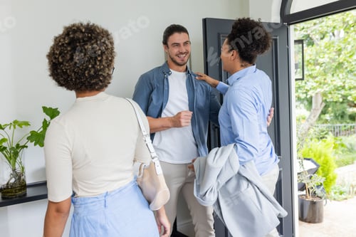 Preview: Friends greeting each other warmly at home, sharing smiles and laughter