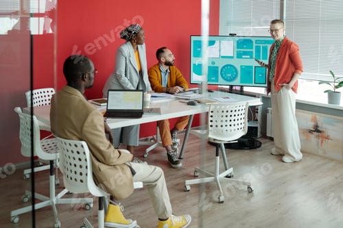 Preview: Team Member Presenting Project During Office Meeting