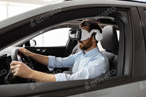 Preview: Man experiencing virtual reality while sitting in a car