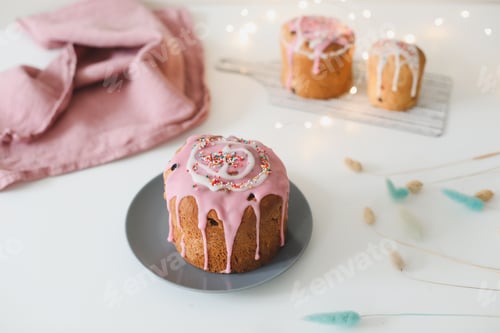 Preview: Happy Easter cake with sprinkles on glaze. Cake on light rustic board. Homemade bakery, spring