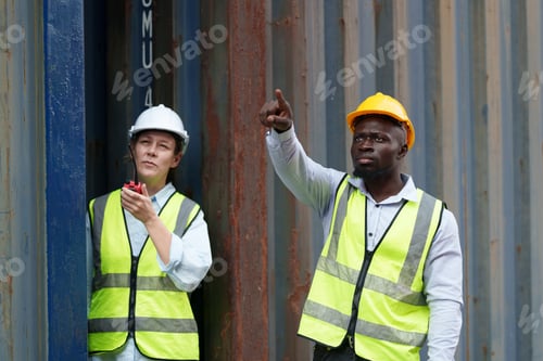 Preview: Workers communicate on construction site during daytime in urban area