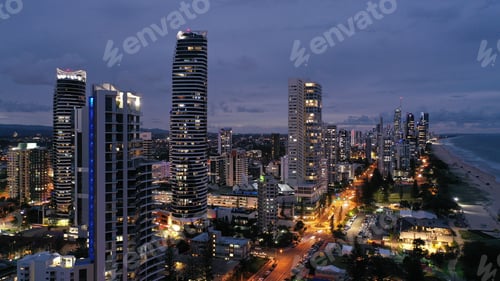 Preview: Amazing night view of modern buildings near the coastline