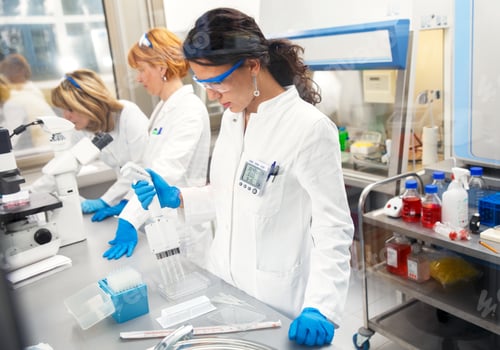 Preview: Photo of three real female scientists researching in laboratory.