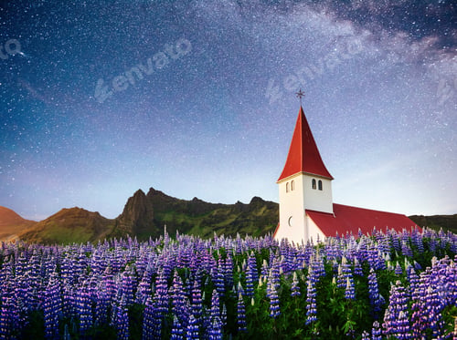 Preview: Beautiful collage Lutheran Church in Vik under fantastic starry sky. Iceland